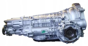 Cutie ZF 5HP19 (VAG 01V, cod 01V300050B, literă FAZ) de pe Audi A8, completă, vedere laterală cu partea de ieșire; anunț de dezmembrări iZAP24 „КПП Audi A8 01V300050B 5HP19 FAZ”